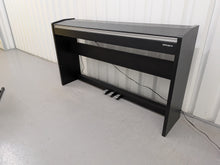 Load image into Gallery viewer, Roland F140R Digital Piano in satin black slim line space saver stock # 26060
