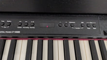 Load image into Gallery viewer, Roland F140R Digital Piano in satin black slim line space saver stock # 26060
