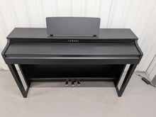 Load image into Gallery viewer, Yamaha clavinova CLP-525 digital piano in satin black colour stock # 26224
