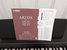 Load image into Gallery viewer, Yamaha Arius YDP-144 digital piano and stool in satin black stock #26247
