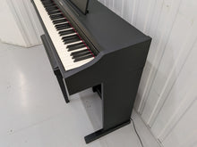 Load image into Gallery viewer, Roland RP102 digital piano and stool in satin black finish stock number 26290
