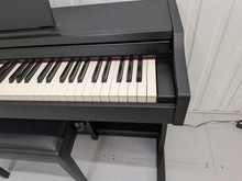 Load image into Gallery viewer, Roland RP102 digital piano and stool in satin black finish stock number 26290
