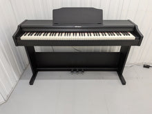 Load image into Gallery viewer, Roland RP102 digital piano and stool in satin black finish stock number 26290
