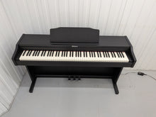 Load image into Gallery viewer, Roland RP102 digital piano and stool in satin black finish stock number 26290
