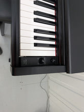 Load image into Gallery viewer, Yamaha Arius YDP-144 digital piano and stool in satin black stock #26286
