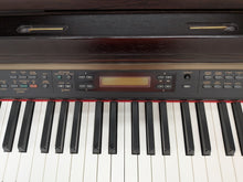 Load image into Gallery viewer, Yamaha Clavinova CLP-150 digital piano and stool in rosewood stock #26302

