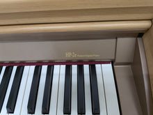 Load image into Gallery viewer, Roland HP-2e digital piano and stool in light oak finish stock number 26312
