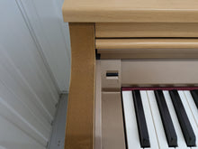 Load image into Gallery viewer, Roland HP-2e digital piano and stool in light oak finish stock number 26312
