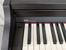 Load image into Gallery viewer, Roland RP301 digital piano in dark rosewood finish stock number 26373
