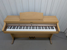 Load image into Gallery viewer, Roland HP102e digital piano in light oak finish stock number 26381
