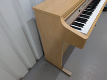 Load image into Gallery viewer, Roland HP102e digital piano in light oak finish stock number 26381
