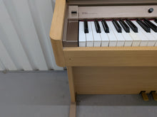 Load image into Gallery viewer, Roland HP102e digital piano in light oak finish stock number 26381

