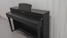 Load and play video in Gallery viewer, Yamaha Clavinova CLP-735 in satin black with stool and manuals stock nr 24354
