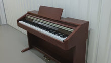 Load and play video in Gallery viewer, Casio Celviano AP-500 digital piano in mahogany finish stock number 24154
