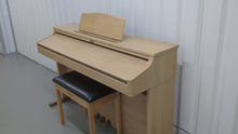 Load and play video in Gallery viewer, Roland HP102e digital piano and stool in light oak finish stock number 24134
