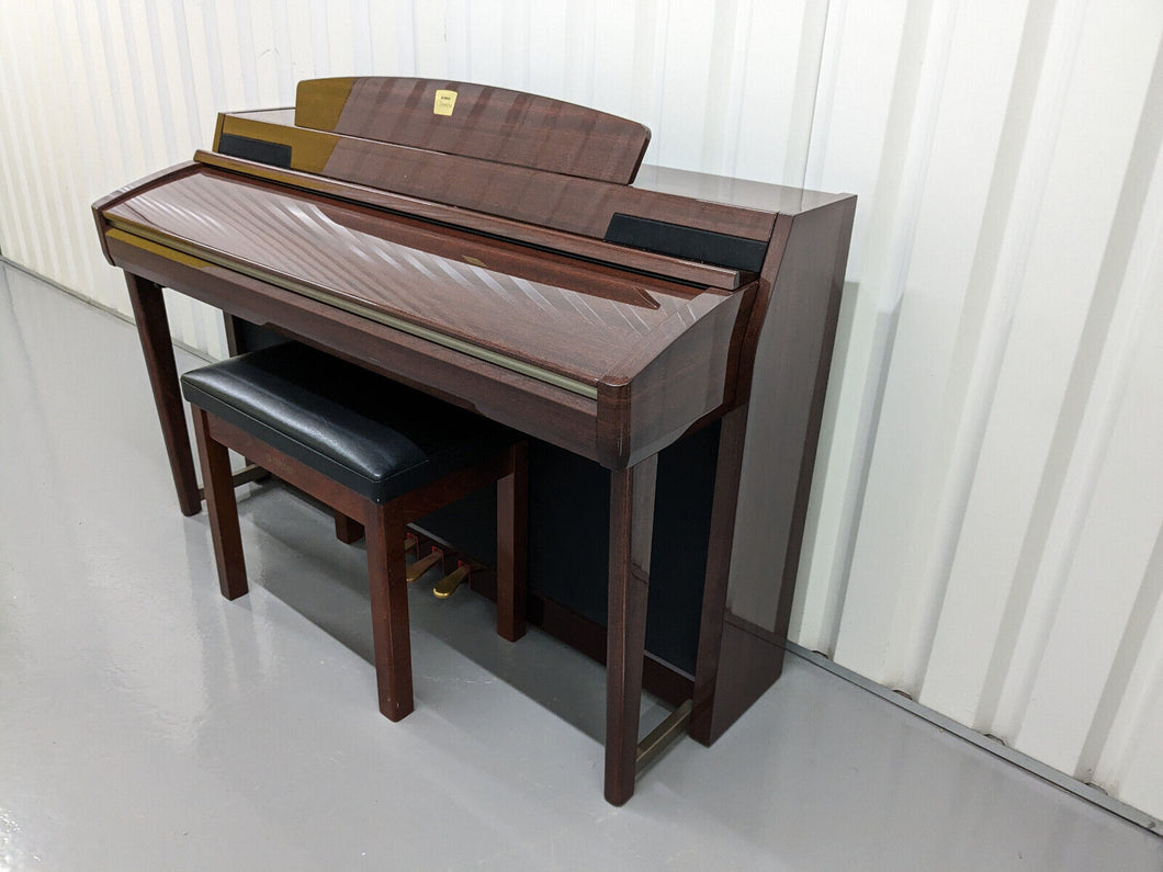 Yamaha Clavinova CLP-280 in Polished Mahogany with matching stool stock nr 23302