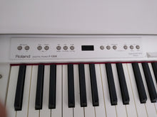 Load image into Gallery viewer, Roland F130R Digital Piano in white with matching colour stool stock # 22136
