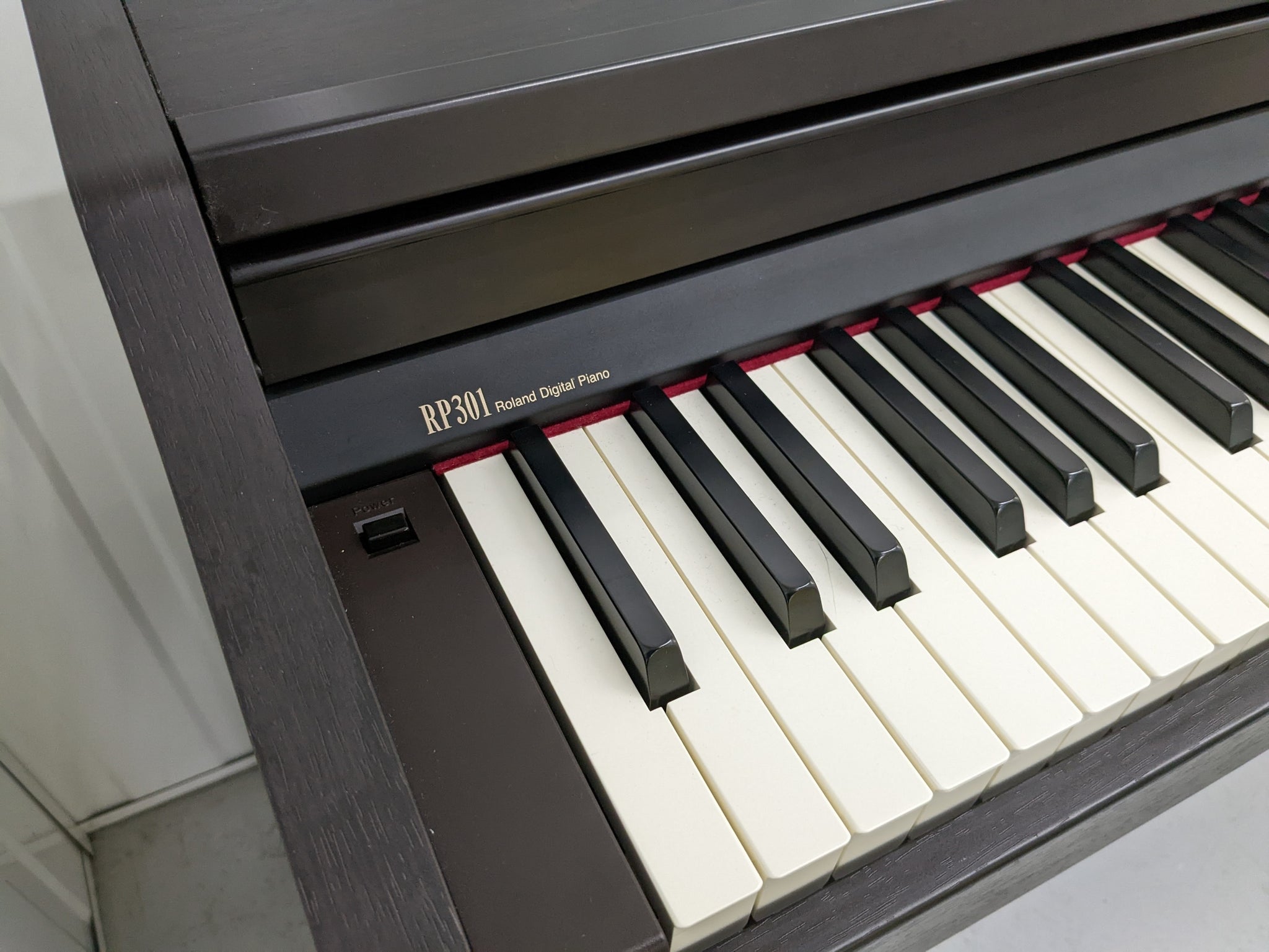 Roland RP301 Digital Piano and stool in rosewood stock # 22300
