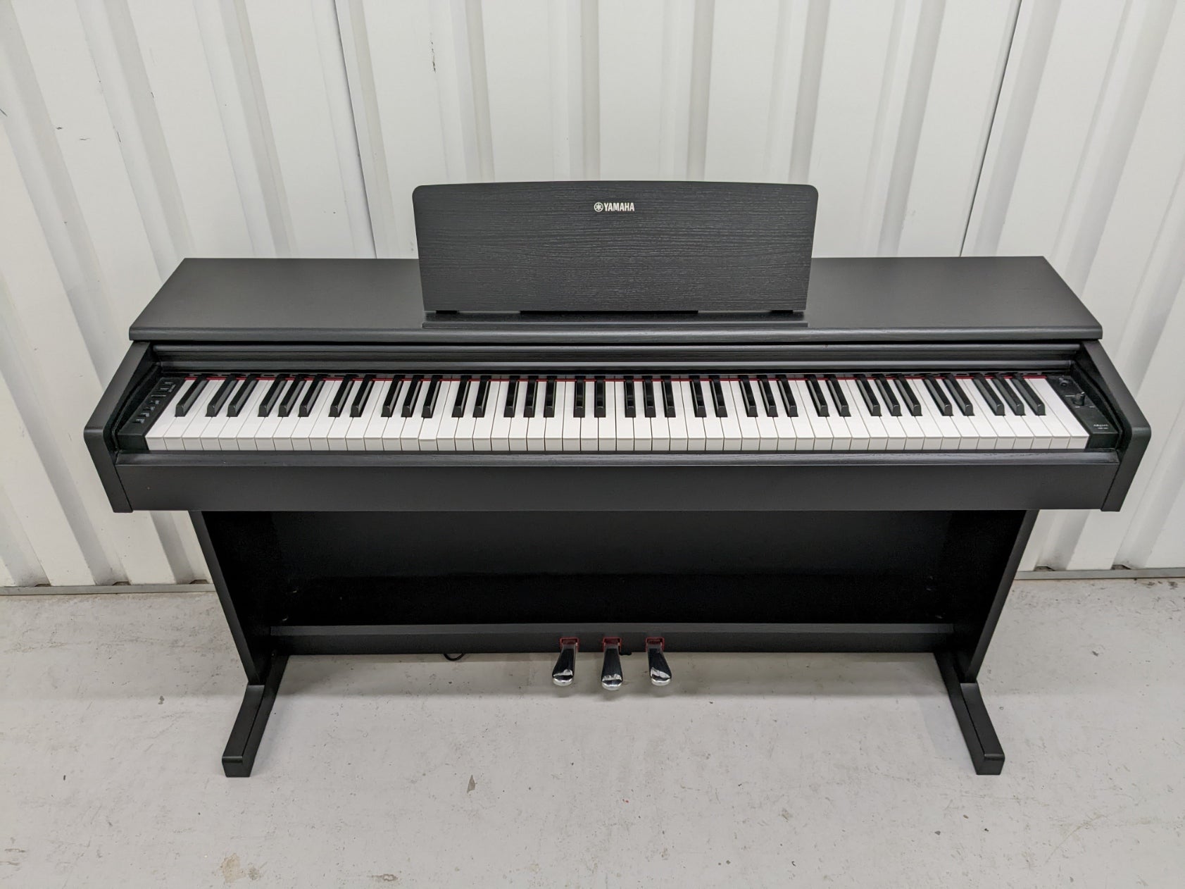 Yamaha Arius YDP-144 digital piano in satin black, weighted keys
